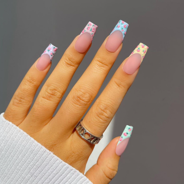 PEACH BETWEEN FINGERS.