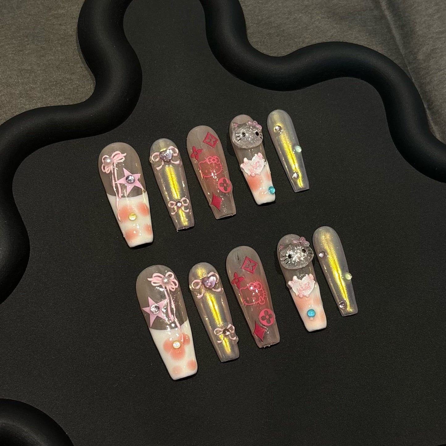 SANIO Y2K HELLO KITTY-TEN PIECES OF HANDCRAFTED PRESS ON NAIL